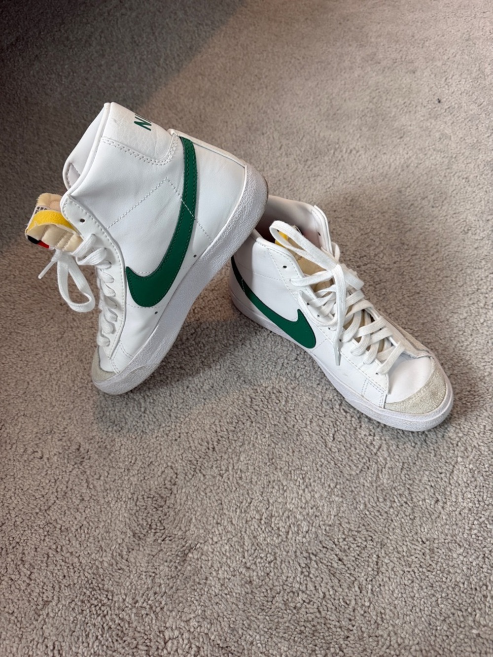 Nike White High-Top Sneakers with Green Swoosh